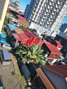 an overhead view of a city with houses and palm trees at apartment Leyla in Batumi