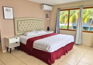 En eller flere senge i et værelse på Quinta del Carmen, Playa San Diego