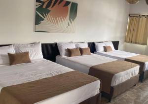 Voodi või voodid majutusasutuse Hotel Palmas De Alcalá toas