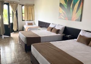 Voodi või voodid majutusasutuse Hotel Palmas De Alcalá toas