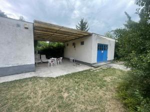 a building with a patio with a table and chairs at SióSpot in Siófok