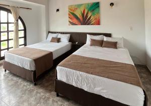 Voodi või voodid majutusasutuse Hotel Palmas De Alcalá toas