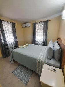 Postel nebo postele na pokoji v ubytování OB Apt 2