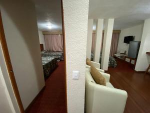 a room with a room with a bed and a mirror at Grupo Hotelero Panoramico in Ciudad Victoria