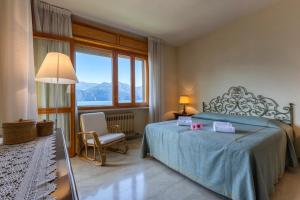 Postel nebo postele na pokoji v ubytování Casa Val di Sogno - Happy Rentals