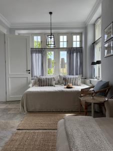 a bedroom with a large bed and a window at SeeBlick Apt 7 Bałtyk Luxury Residence in Międzyzdroje