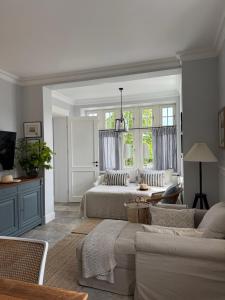 a living room with a bed and a couch at SeeBlick Apt 7 Bałtyk Luxury Residence in Międzyzdroje +75 photos