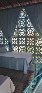 Una cama o camas en una habitación de Vistamar Arco das Flores 2