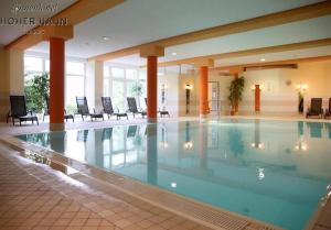 a large swimming pool in a hotel lobby at ErzZeit Urlaub mit Weitblick in Schwarzenberg/Erzgebirge