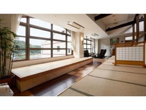 a large room with a couch and a large window at Hotel Aoshima Cinqmale - Vacation STAY 67414v in Miyazaki