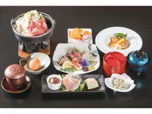 a group of plates of food on a table at Hotel Aoshima Cinqmale - Vacation STAY 67405v in Miyazaki
