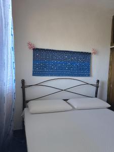 Katil atau katil-katil dalam bilik di Appartamento Taras Sottovento - Porto Cervo