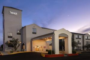 a building with a sap sign on the side of it at Spark by Hilton El Paso University in El Paso