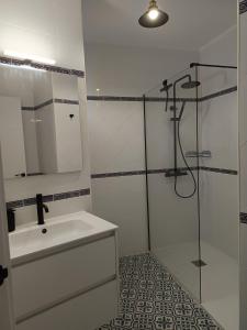 a white bathroom with a sink and a shower at Casa Walt in Mojácar +29 photos