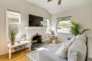 a living room with a couch and a fireplace at Walk to Dtwn San Jose and SJSU Charming and Cozy Gem! in San Jose