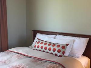 Postel nebo postele na pokoji v ubytování Hôtel Maison Blanche
