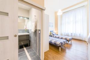Un pat sau paturi într-o cameră la API Flat
