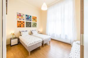 Un pat sau paturi într-o cameră la API Flat