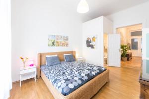 Un pat sau paturi într-o cameră la API Flat