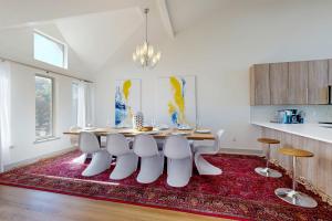 a dining room with a table and chairs on a rug at Pacific Dream in Neskowin +19 photos