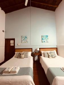 Postel nebo postele na pokoji v ubytování Casa Isabelita