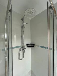 a shower with a glass door in a bathroom at APCOSTAS Palmavera Playa de la Conxa in Oropesa del Mar +102 photos