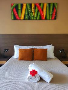 Letto o letti in una camera di Vaea Hotel Samoa