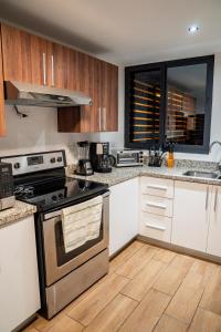 Dapur atau dapur kecil di Apartment With Pool In Colonia Escalon
