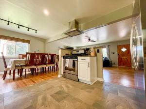 a living room with a kitchen and a dining room at One Blue Rose in Colorado Springs