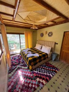 Postel nebo postele na pokoji v ubytování auberge atlas tamatertt