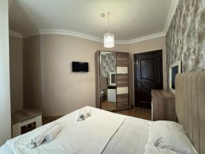 Voodi või voodid majutusasutuse Karo Hotel toas