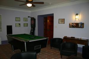 a living room with a pool table and a ceiling fan at Casa del Renacimiento in Alcaraz