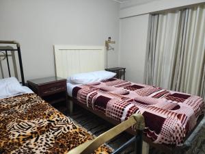 Ένα ή περισσότερα κρεβάτια σε δωμάτιο στο Residencial Cucharita y Palo