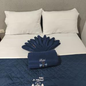 Postel nebo postele na pokoji v ubytování Hotel Saint Michael