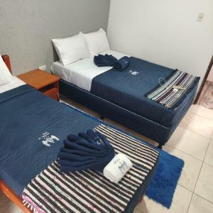 Postel nebo postele na pokoji v ubytování Hotel Saint Michael