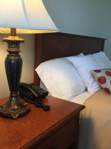 Postel nebo postele na pokoji v ubytování Hôtel Maison Blanche