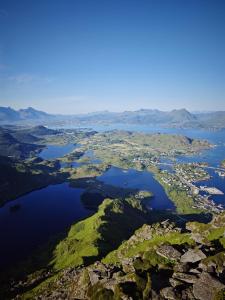 an aerial view of a group of islands in a body of water at 2 Houses & A Barn Double Room in Vestvågøya