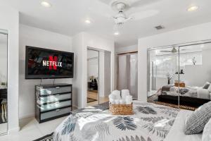 a living room with a tv on a wall at Quiet Home with Spectacular Scenic Mountain Views near Universal Studios Hollywood in Los Angeles