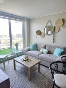 a living room with a couch and a table at 505 ,Depto studio NUEVO!, Boutique in Viña del Mar