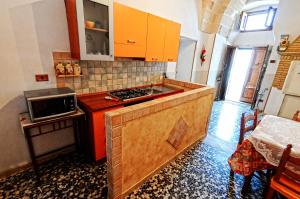 Kuchyň nebo kuchyňský kout v ubytování casa vacanze Filomena