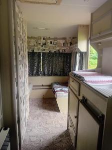 an inside view of a room with two beds at Camping -Dor de Munte -Ceahlau in Bistricioara