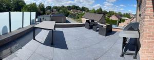 a skate park with benches on top of a building at Duplex appartement 'De Wijers' met 3 slaapkamers in Genk
