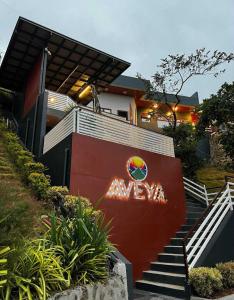 a house with a sign on the side of it at AVEYA Staycation in Tanay