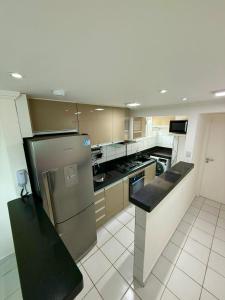 Kuchyň nebo kuchyňský kout v ubytování Apartamento natal 804 vista do morro do careca