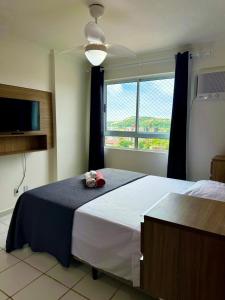 Postel nebo postele na pokoji v ubytování Apartamento natal 804 vista do morro do careca