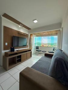 TV a/nebo společenská místnost v ubytování Apartamento natal 804 vista do morro do careca + 29 fotografií