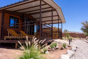 a house with a wrap around porch in the desert at Luna de Chañares in San Pedro de Atacama +29 photos