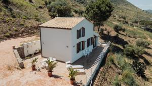 an aerial view of a white house on a hill at Villa Michela - Dimora di Charme a Cefalù con panorama sul mare in Cefalù