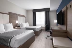 Voodi või voodid majutusasutuse Best Western Plus Gateway to the Falls toas