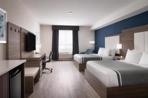 Voodi või voodid majutusasutuse Best Western Plus Gateway to the Falls toas